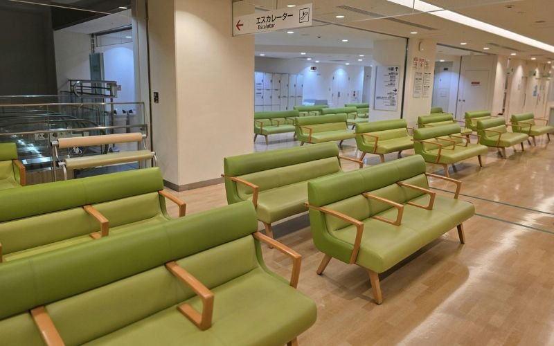 Family seated in hospital waiting area in Nigeria and Kenya