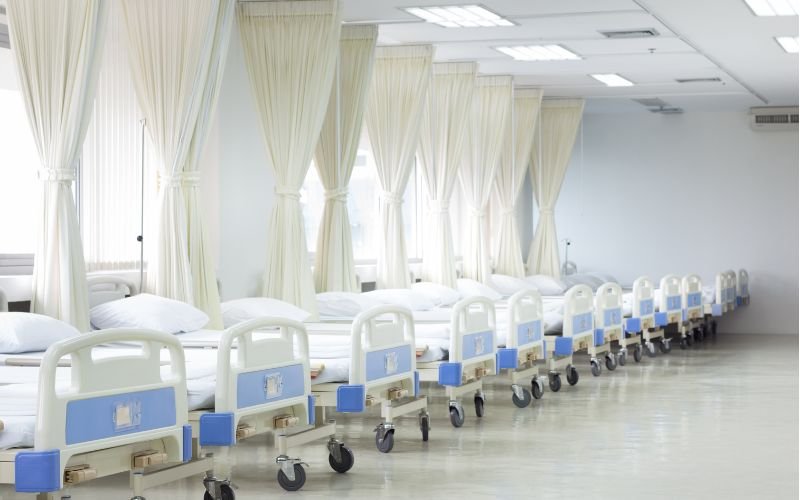 Fluid resistant seamless upholstery and steel frame detail on hospital maternity bed
